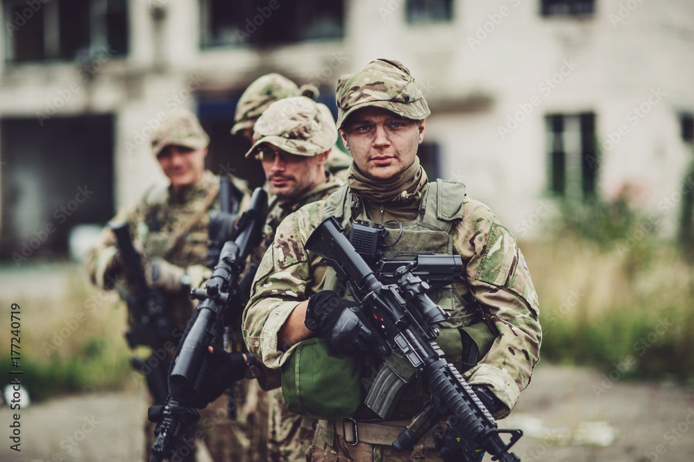 Army sniper during the military operation in the city. war, army, technology and people concept. Army sniper during the military operation in the city. war, army, technology and people concept.
