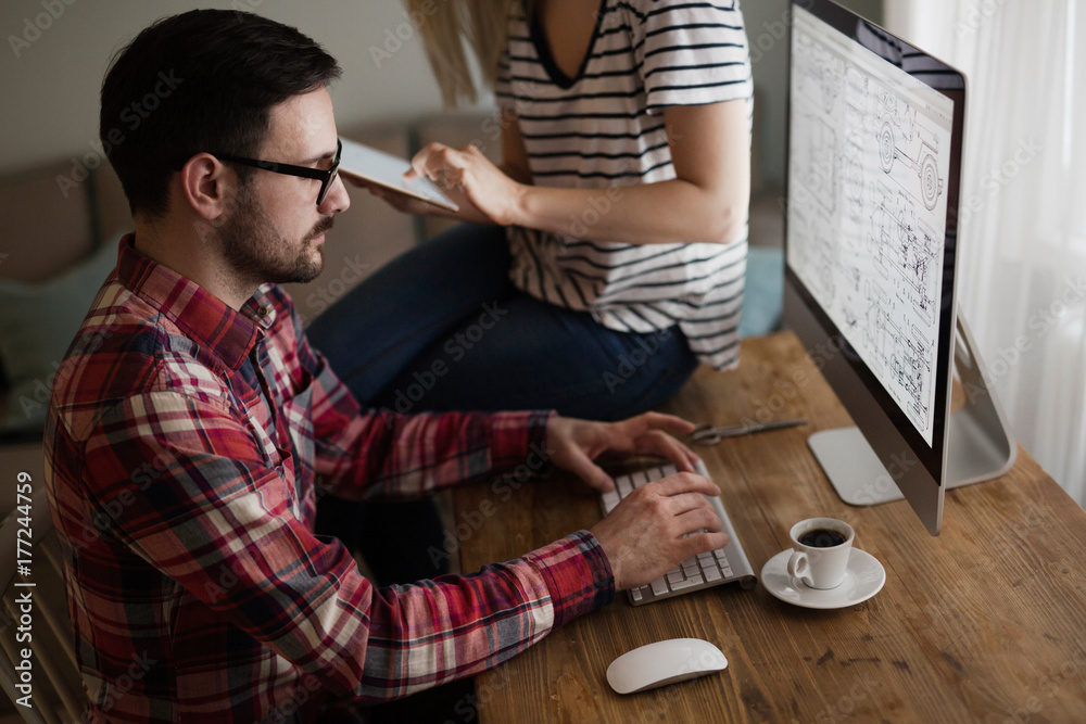 Beautiful woman and attractive man doing design work Beautiful woman and attractive man doing design work