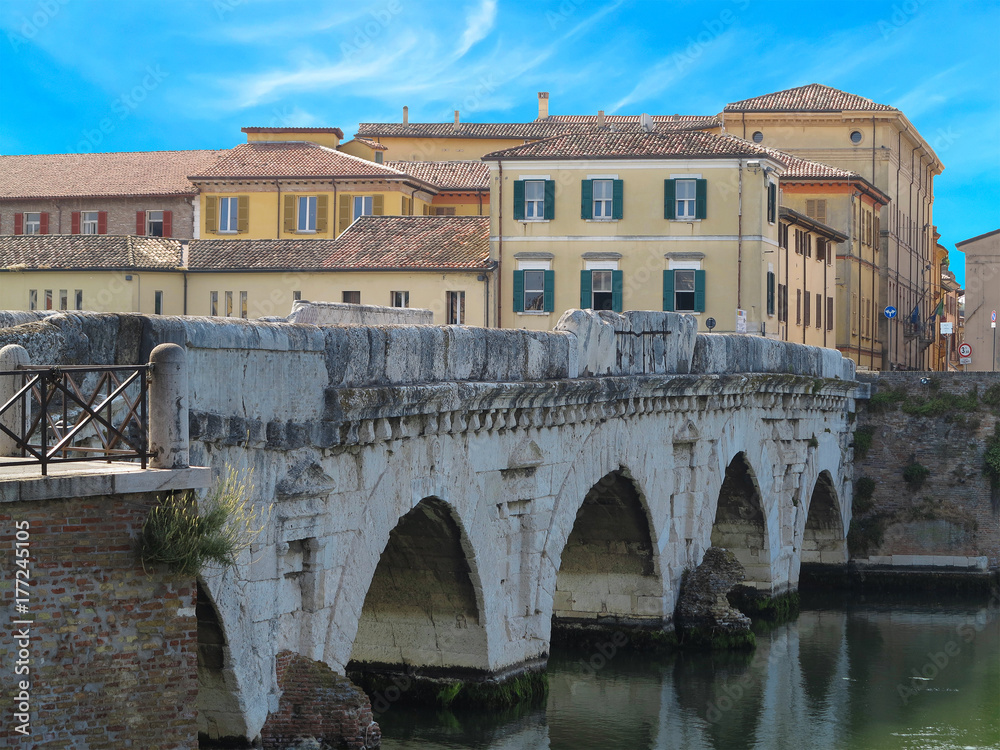 Historical roman Tiberius bridge over Marecchia river, Rimini, Italy