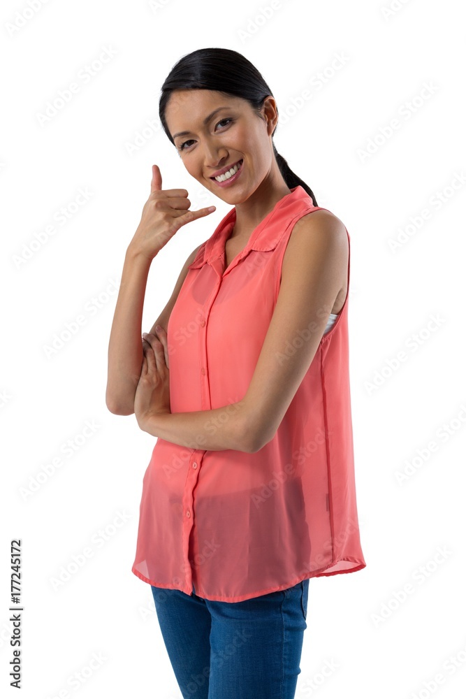 Beautiful woman gesturing against white background