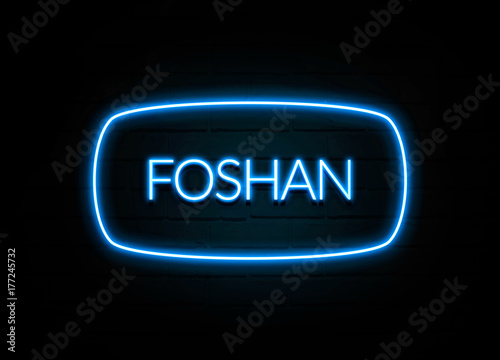 Foshan - colorful Neon Sign on brickwall