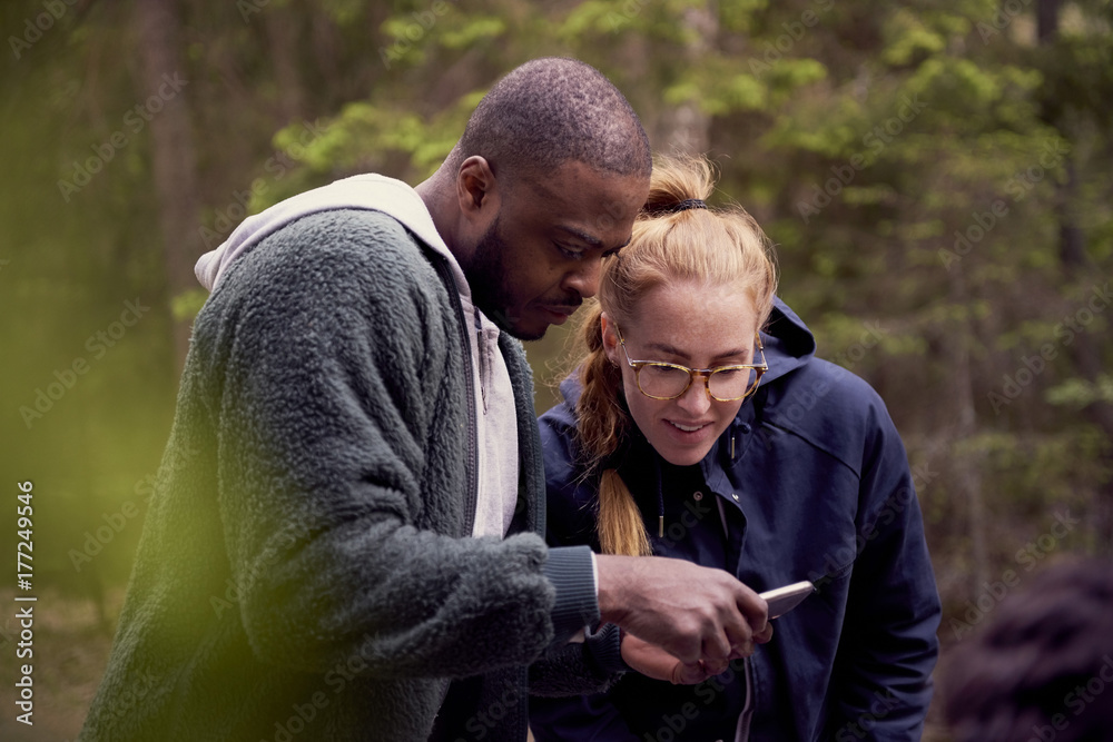 Man and woman looking at smartphone Man and woman looking at smartphone