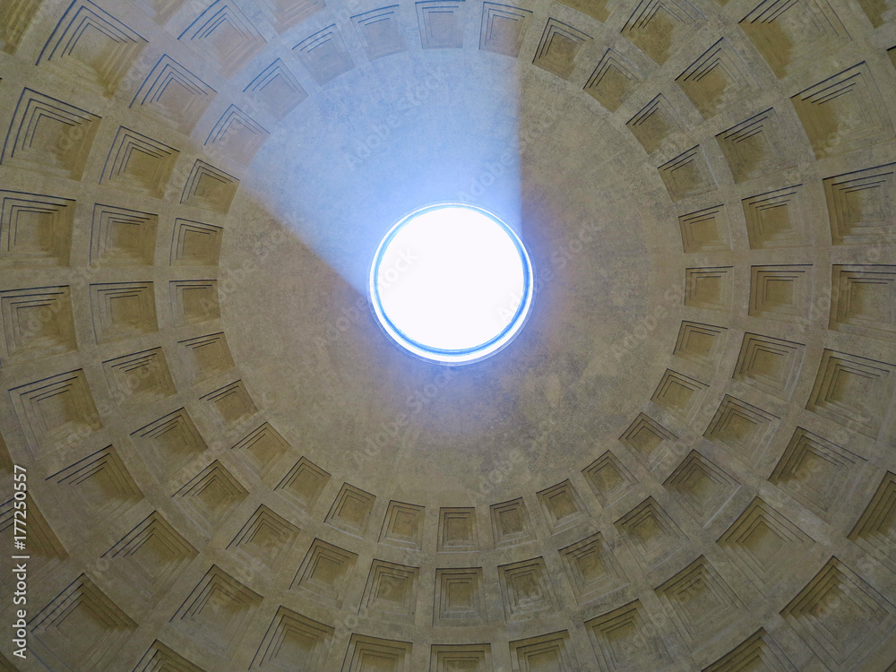 antheon dome as seen from inside the Pantheon with a visible light beam coming through the open hole.
