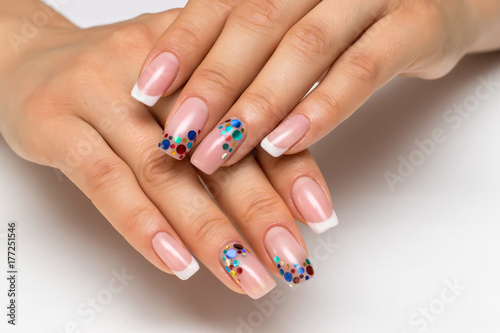 wedding French white manicure with sparkles of confetti on long square nails  