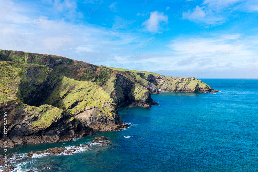 Sunlight catches the headland close to the pretty village of Port Isaac