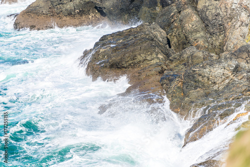 Waves crashing onto rocks of the north Cornwall coastline