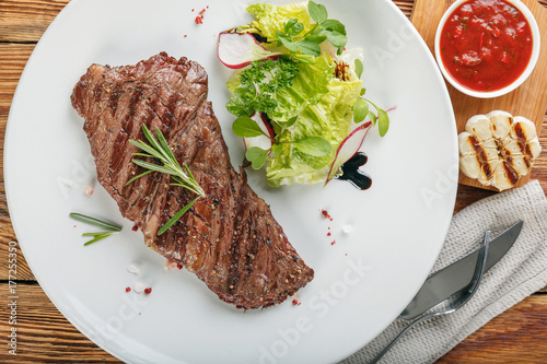 Fried steak machete on a white plate photo