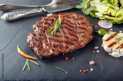 BBQ ribeye steak on a stone Board