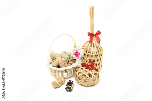 Thai traditional dessert in wicker bamboo basket On white background.