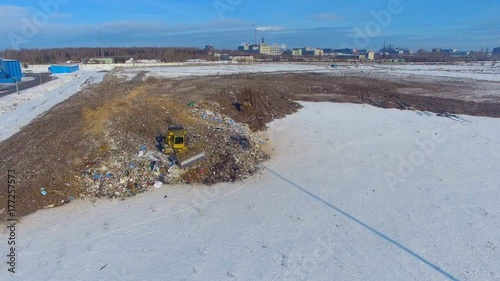 A large landfill site with two operating compactors tractors.
