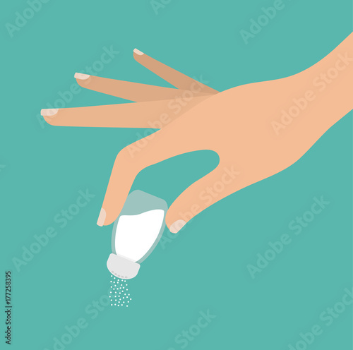 Woman's hand using or holding salt keeper photo