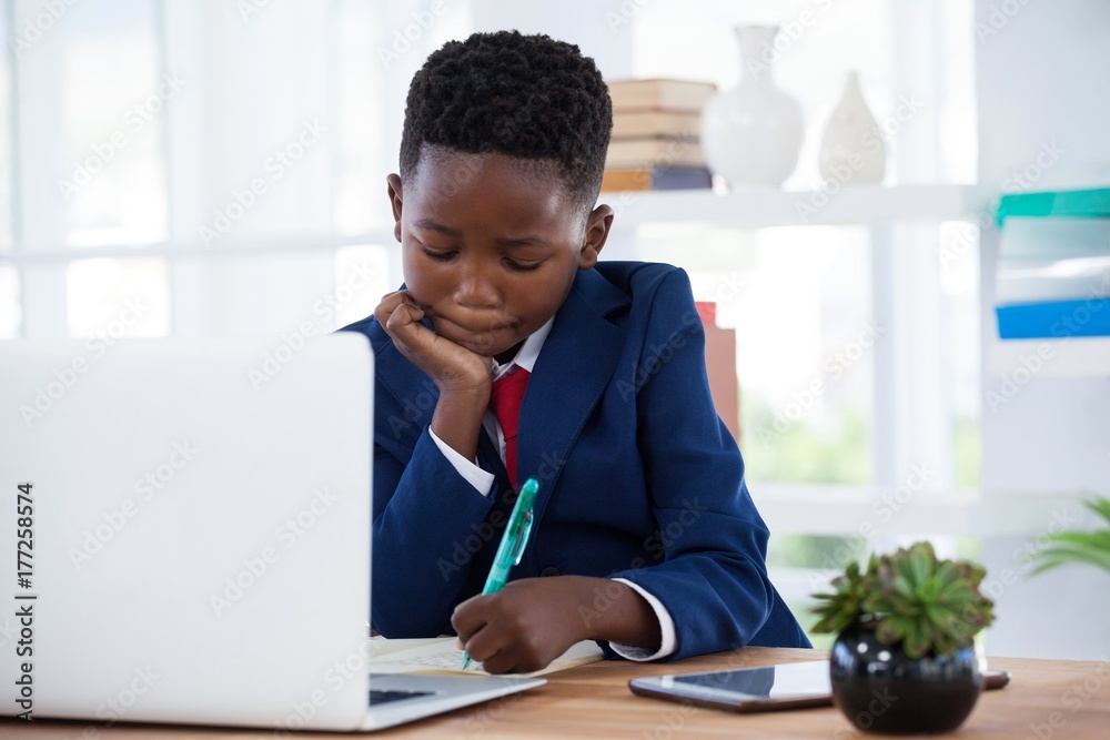 Businessman writing on paper