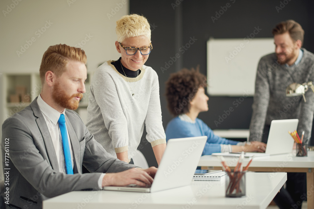 Multi ethnic group working in modern office Multi ethnic group working in modern office