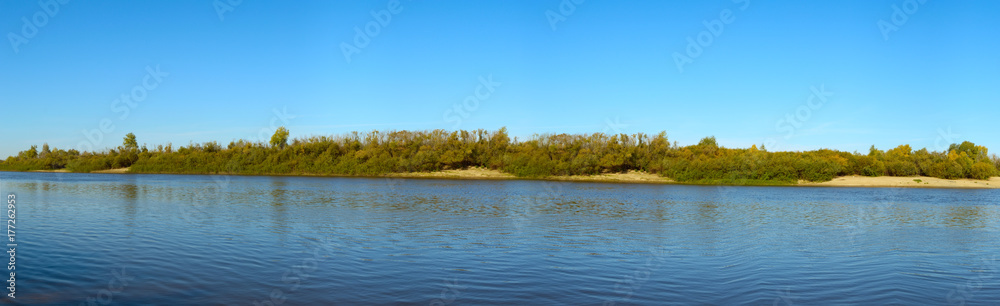 Panorama of the autumn river and forest