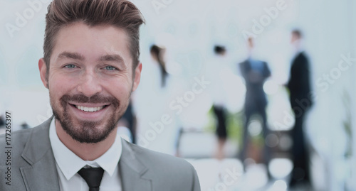Handsome Business man in an office with blurred  background