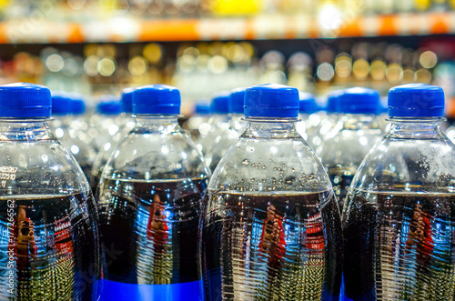 Many bottles with pepsi top view. background made by big pepsi bottles