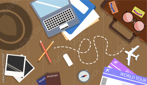 Flat illustration Top view of travel items on wooden table with road trip icon