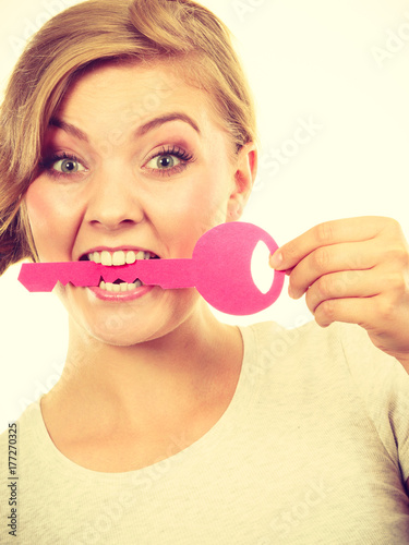 Teenage girl with braid biting key