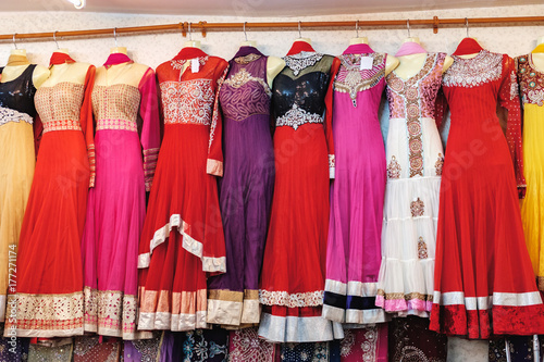 Traditional Indian women's clothing for sale at the street market in Chinatown district, Bangkok, Thailand. Multicolored elegant dresses for beautiful women