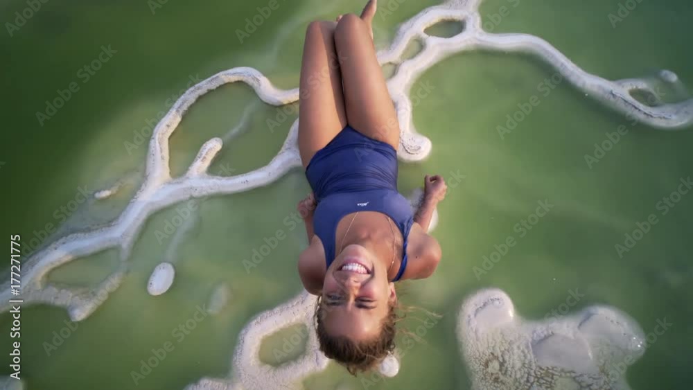 young women siting in natural mineral pool, look at camera, smile and have fun, Mexico Hierve el Agua