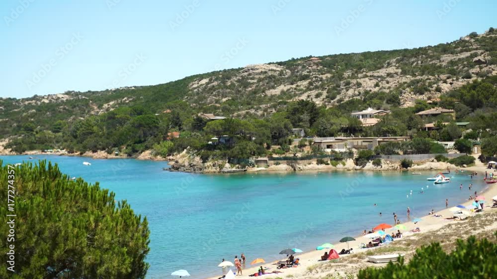 Beautiful bay in Sardinia with the beach with some beach umbrellas on it, 4K Beautiful bay in Sardinia with the beach with some beach umbrellas on it, 4K