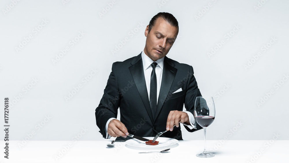 Bloody Halloween theme: crazy man with a knife, fork and meat Bloody Halloween theme: crazy man with a knife, fork and meat