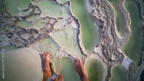 pov, young couple walking together on calcium terrace,close up legs, Mexico Hierve el Agua