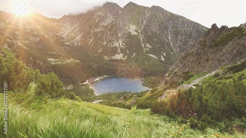 Tatry mountains in Poland. Panorama of mountain range, lake and green forest. Summer nature landscape, view from hiking trail. Beauty world, sport lifestyle, holidays, travel and recreation. Full HD