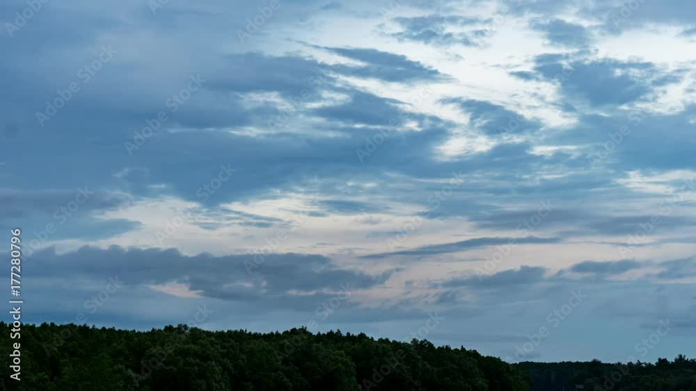 Clouds flow in the sky above the tropical forest Clouds flow in the sky above the tropical forest
