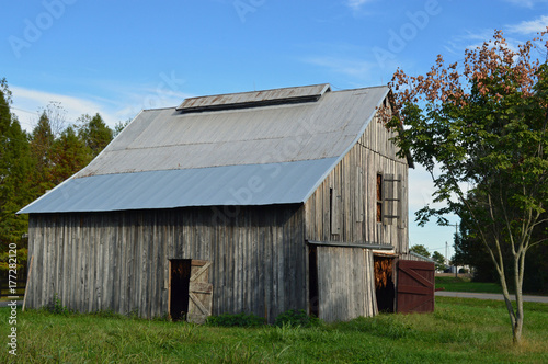 Rural landscape photo of an old tobacco barn drying tobacco