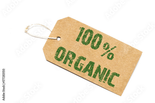 one hundred percent organic  sign- a paper price tag on a white background - shopping concept photo