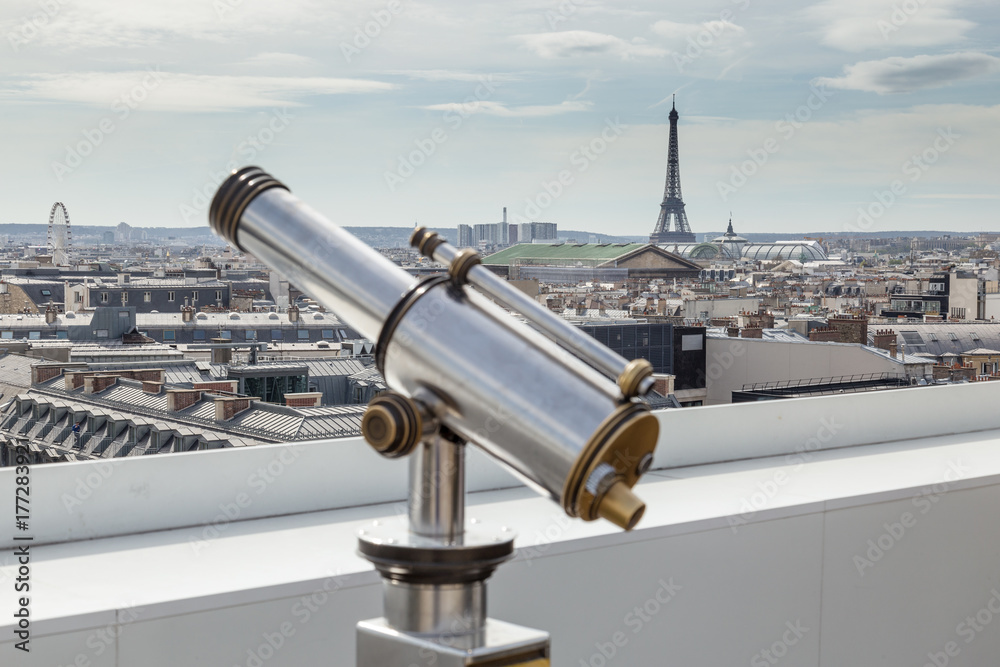 Binoculars telescope and view on Paris