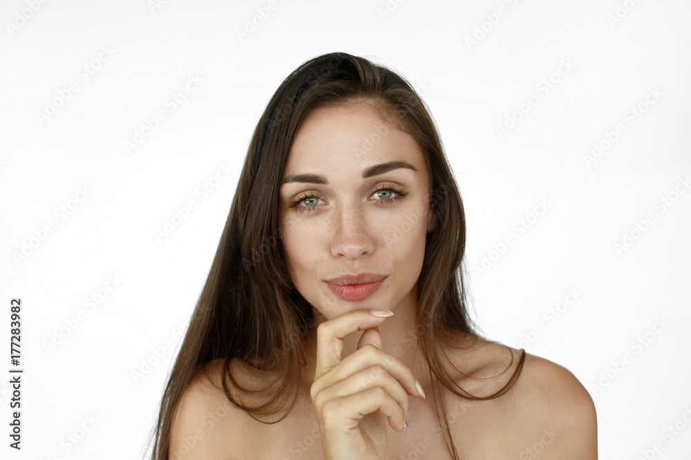 Girl looks interested holding fingers on her chin Girl looks interested holding fingers on her chin