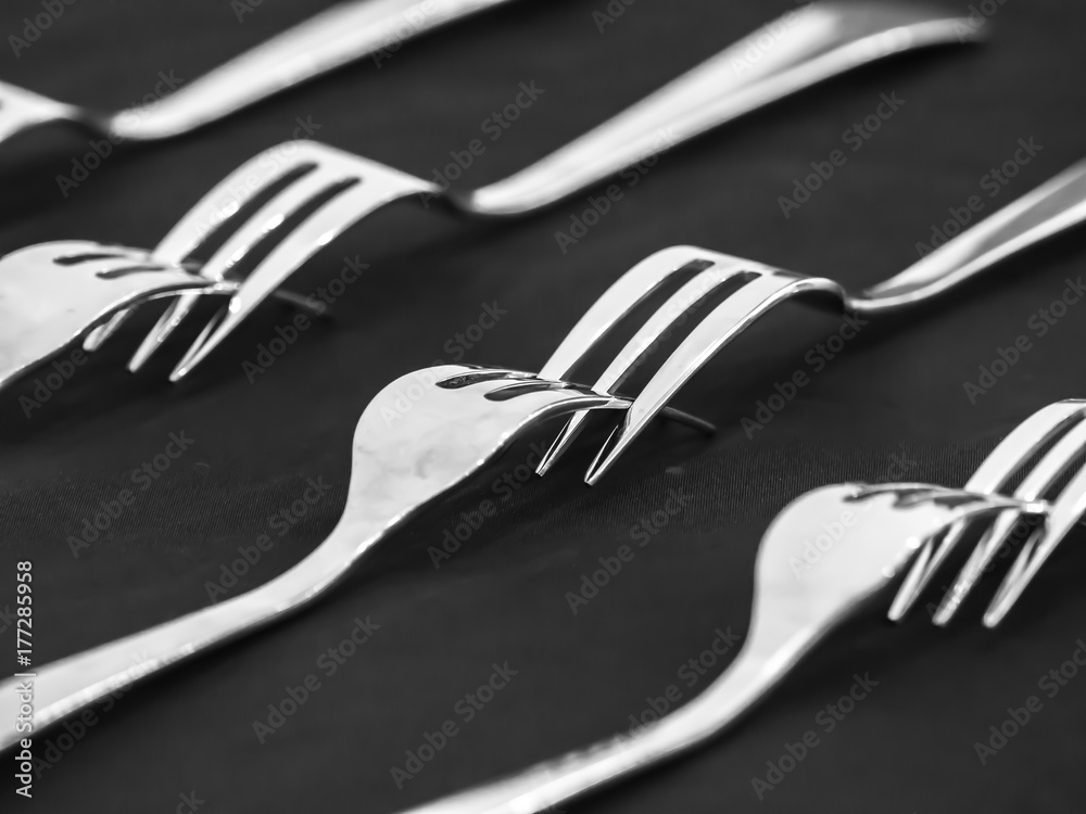 Closeup of matching forks on the white table. Closeup of matching forks on the white table.