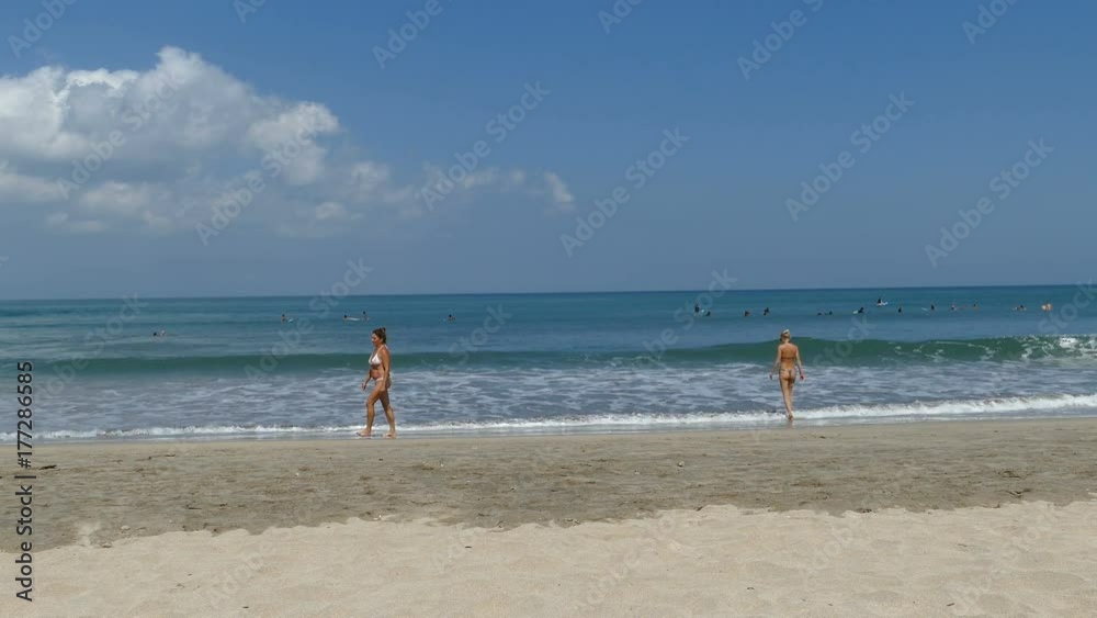 Women in sea of Kuta beach, Bali, Indonesia Women in sea of Kuta beach, Bali, Indonesia