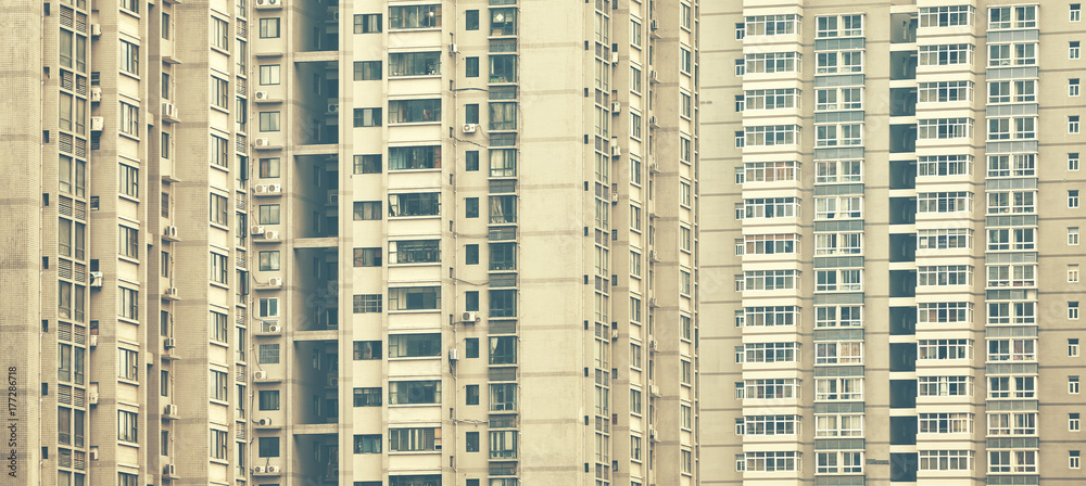 Retro stylized picture of apartment buildings, urban background.