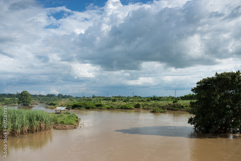 Fototapeta premium Countryside landscape and hut in river