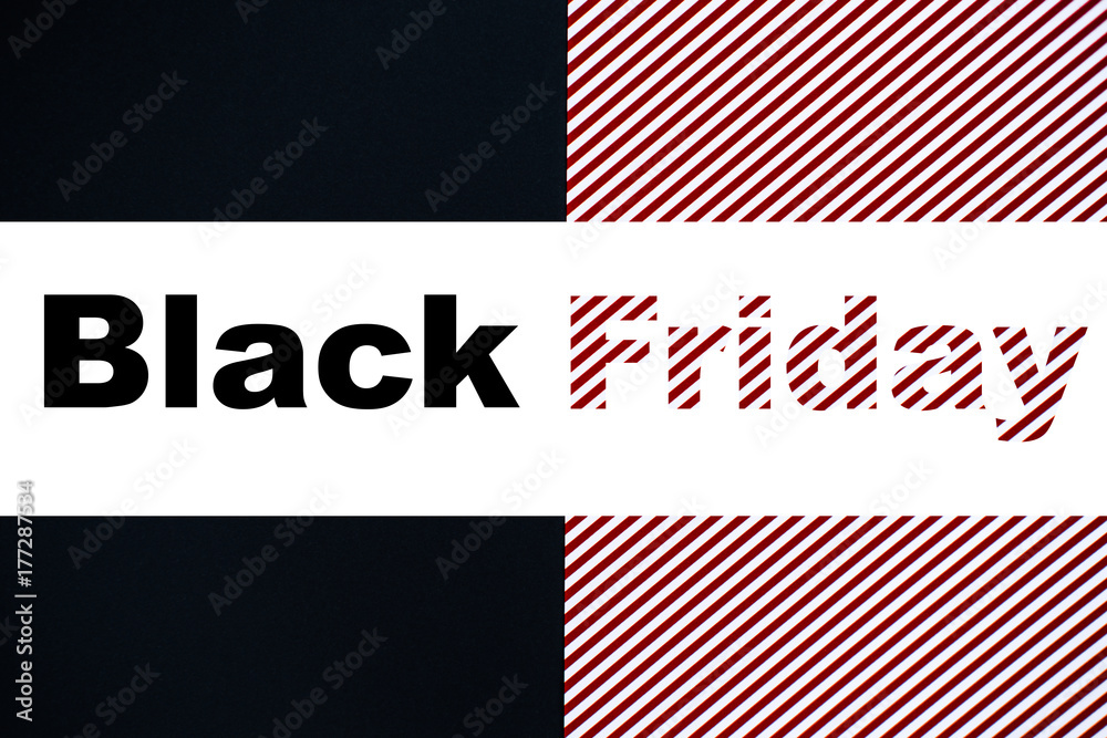 Creative text Black Friday on black, red and white striped background Creative text Black Friday on black, red and white striped background