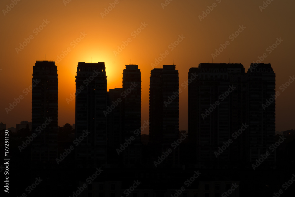 Sunset landscape between buildings