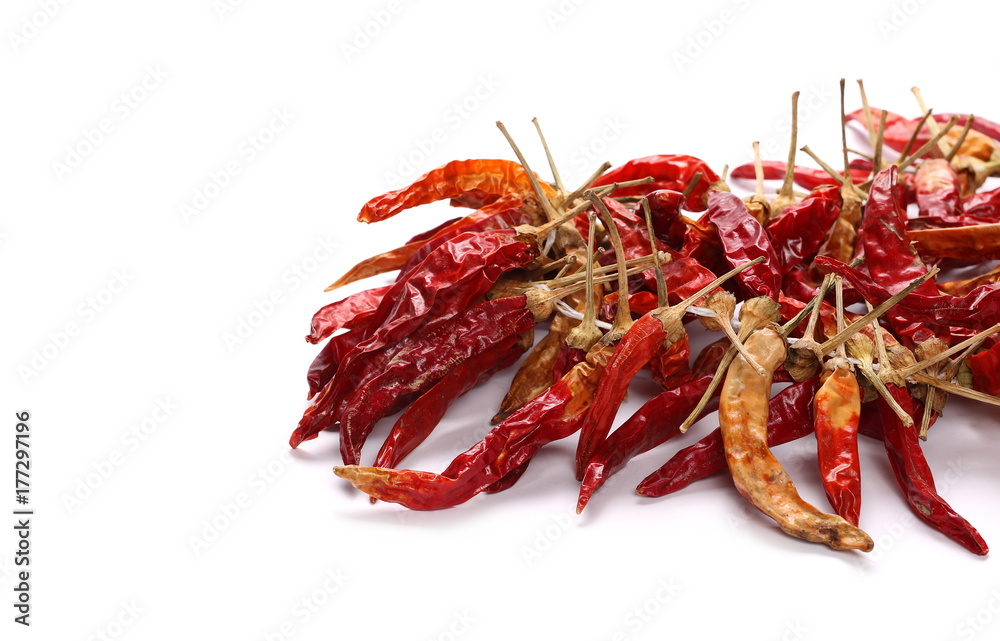 Dry red hot chili peppers, pile isolated on white background Dry red hot chili peppers, pile isolated on white background