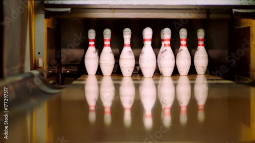 Bowling ball knocking pins on the bowling lane. Slow motion