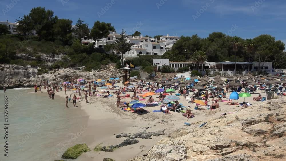 Cala Anguila Mallorca Spain: Tourists swimming on a small Spanish beach Cala Anguila Mallorca Spain: Tourists swimming on a small Spanish beach