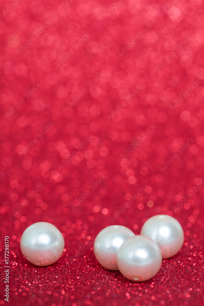 Pile of pearls on red christmas background