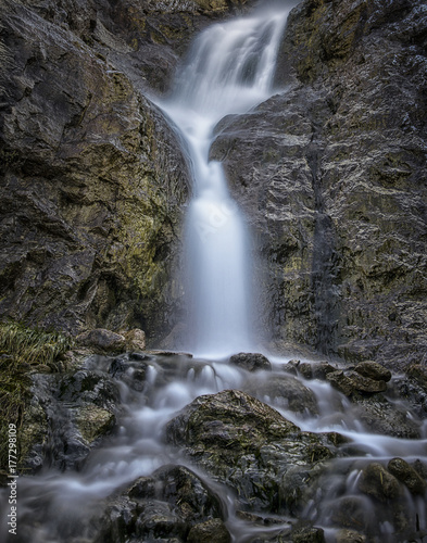 Vertical Color Image of blurred water in a water fall