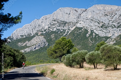 Road at the feet of the Sainte Victoire mountain in France photo