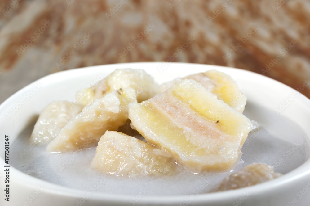 Closeup banana in Coconut Milk. Thai dessert. Banana sliced boil in coconut milk with sugar. Sweet taste and Hi nutritiion. Closeup banana in Coconut Milk. Thai dessert. Banana sliced boil in coconut milk with sugar. Sweet taste and Hi nutritiion.