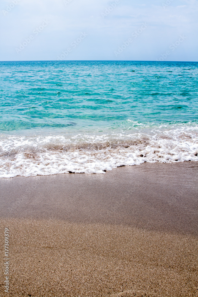 Beautiful beach and aqua waves, clean sand, calm sea Beautiful beach and aqua waves, clean sand, calm sea