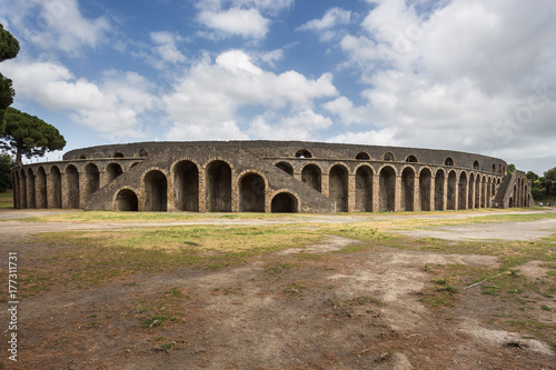 Fototapet The amphitheatre in the archaeological site of Pompeii, a city destroyed by the