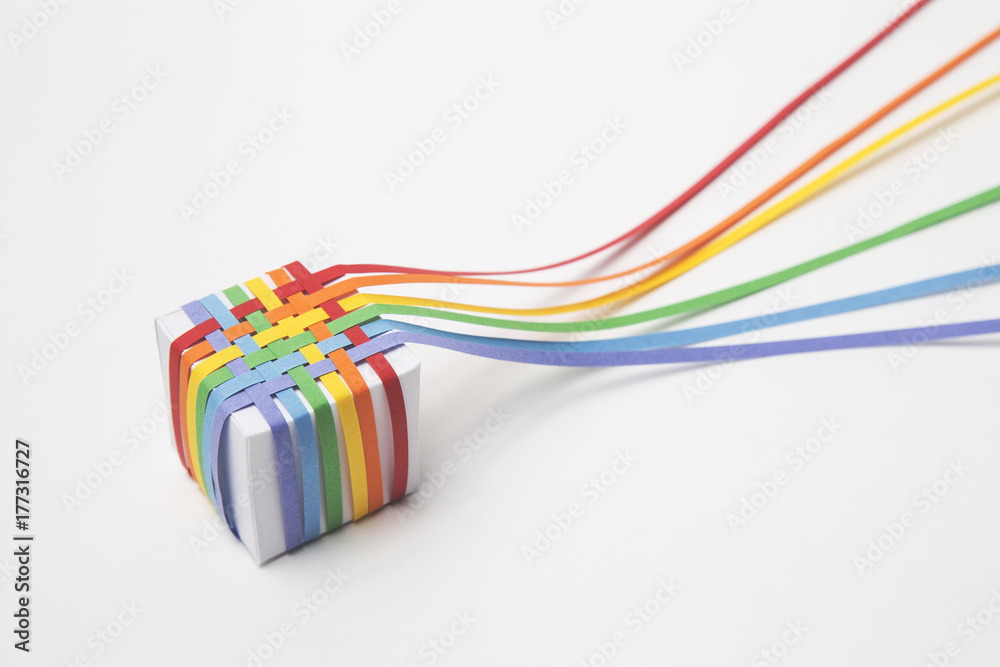 Woven rainbow paper covered cube Woven rainbow paper covered cube