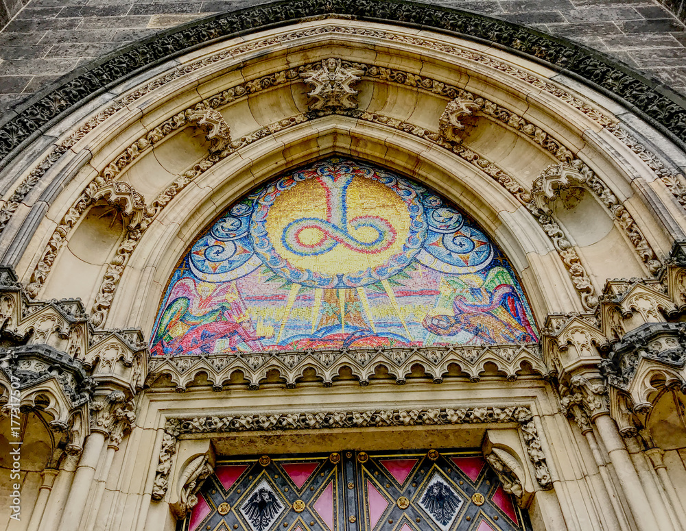 The colorful and decorated main entrance of the Vyšehrad cathedral in Prague in Czech Republic. HDR effect.